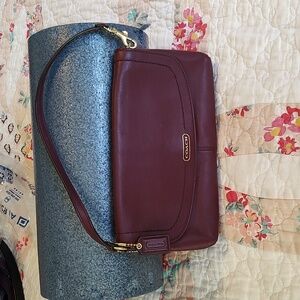 Coach Burgundy clutch, wristlet, shoulder bag.